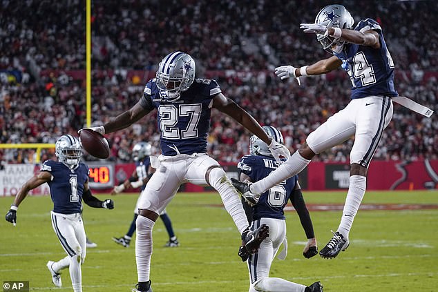 Cowboys celebrate after making the most of Brady's terrible shot to the end zone