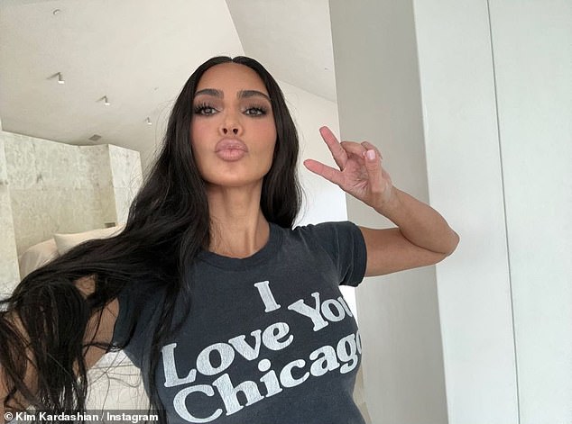 Doting mom: The mother-of-four rocked a T-shirt reading 'I love you Chicago' to the party