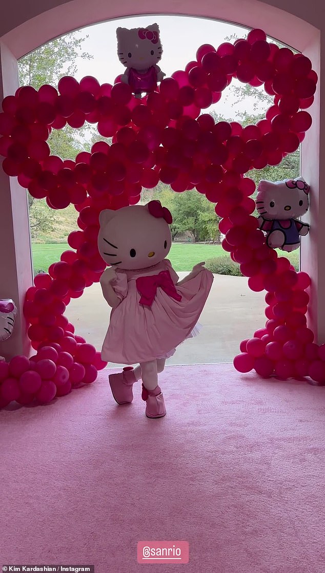 So cute: Kim shared snaps and videos from the party, including Hello Kitty arriving and posing next to a display of balloon arches