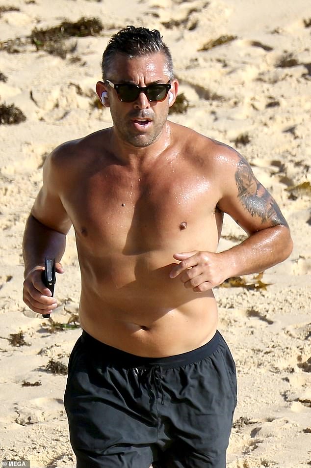 The newly single sports star, 41, showed off his sporty figure as he jogged across the arena shirtless and donning a pair of black Nike shorts.