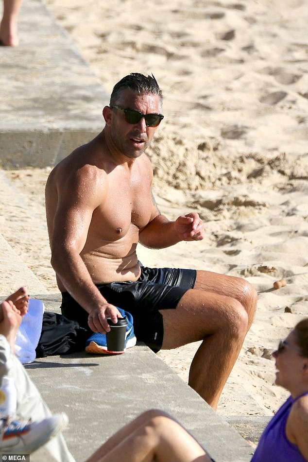 He then took a brief dip in the ocean to cool off and sat down on a concrete slab to enjoy a coffee to go.