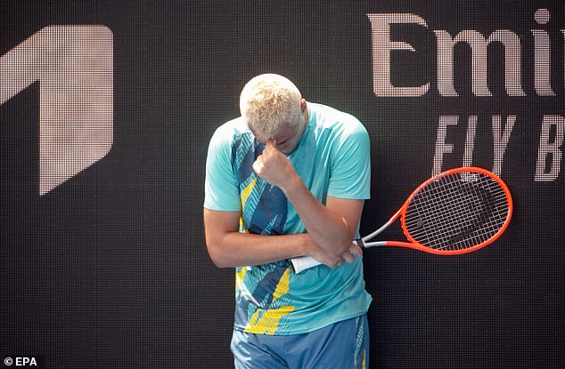 Tomic is seen in action during his match against Roman Safiullin of Russia during their Australian Open qualifying match at Kia Arena in Melbourne Park in 2022