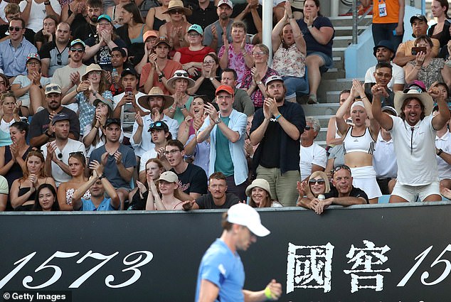 Fans cheer during the match between John Millman of Australia and Marc-Andrea Huesler of Switzerland during the first day of the Australian Open 2023