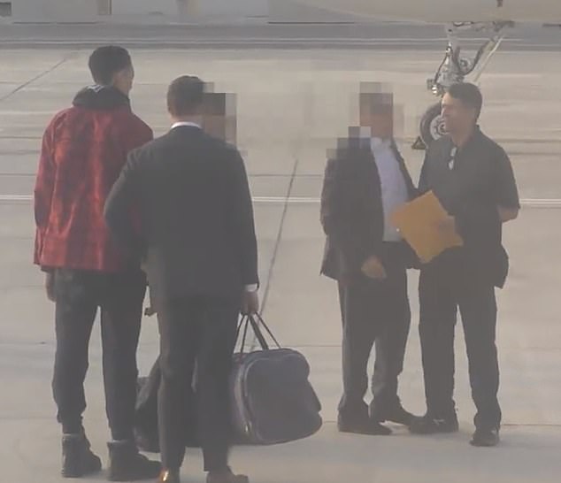 On December 9, after nearly 10 months in custody, Griner was traded in a prison swap (pictured left in red) for Viktor Bout.