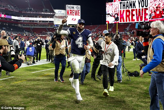 Dak Prescott #4 of the Dallas Cowboys celebrates as he runs into the tunnel after an NFL Wild Card Playoff football game against the Tampa Bay Buccaneers at Raymond James Stadium