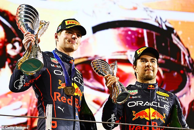 Max Verstappen is pictured with Sergio Perez of Mexico on the podium during the Abu Dhabi F1 Grand Prix at Yas Marina Circuit on November 20, 2022 in Abu Dhabi.