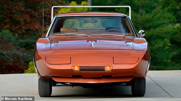 The model sold is one of 22 Daytonas that were painted T5 Copper Metallic, complete with a white wing stripe and tan interior.