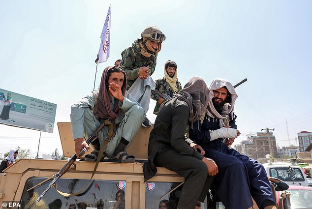 Taliban forces recaptured capital city Kabul in August 2021 after nearly 20 years and took control of the country. Pictured: Taliban fighters are seen on the back of an armoured vehicle in Kabul, Afghanistan, August 16, 2021