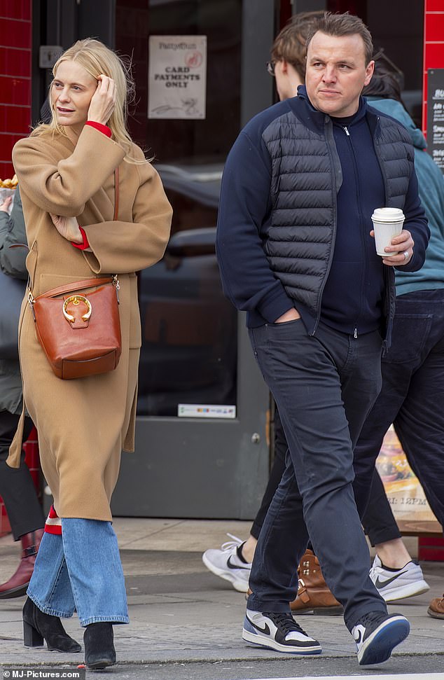 Outfit: Meanwhile, Damian wore a navy blue sweater and vest which he paired with comfortable Nike sneakers.