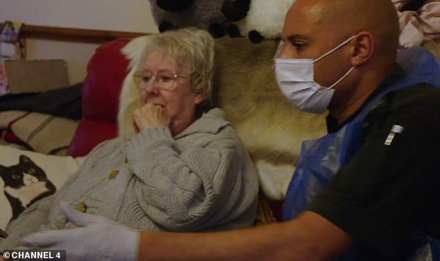 Paramedic Paul (right) sat with Lilian (right) as they waited for her sister to arrive. She told him: 'I'm glad you were here as I don't know how I would have coped.'