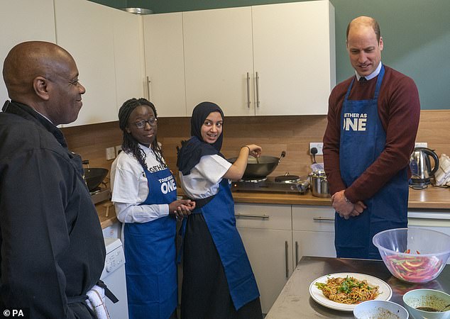 The Prince of Wales takes part in a cooking lesson with Daisha Nagawagi 12, Inaaya Shahab 13 and Chef Kevin Muhammad