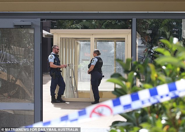 Police are seen in the unit block after Ms Isaac's body was found on Monday afternoon.