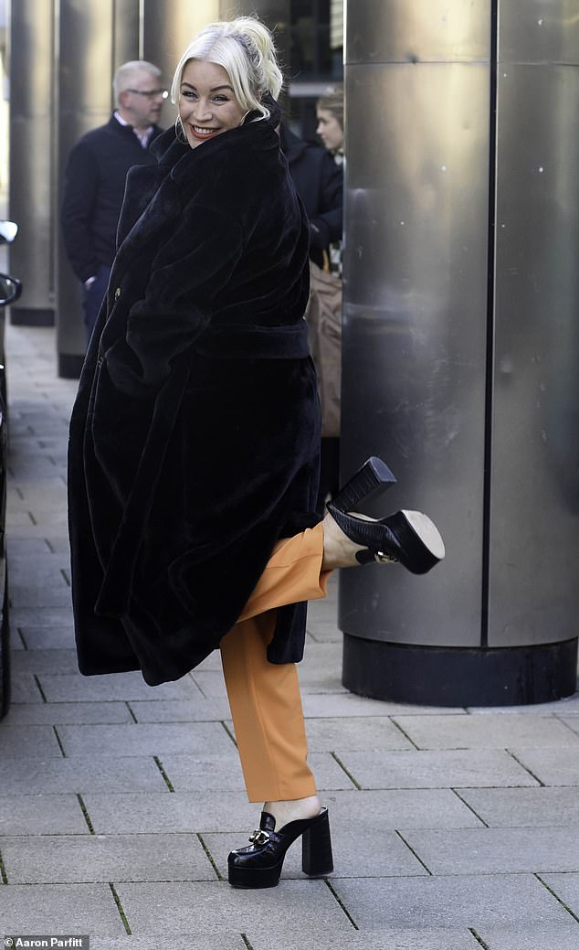 Stylish: The 48-year-old host, who appears regularly on the show, wore a black and white striped jumper teamed with orange pants from Forever Unique.