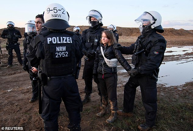 Police detain climate activist Greta Thunberg on Tuesday during protests at a mine in Luetzerath