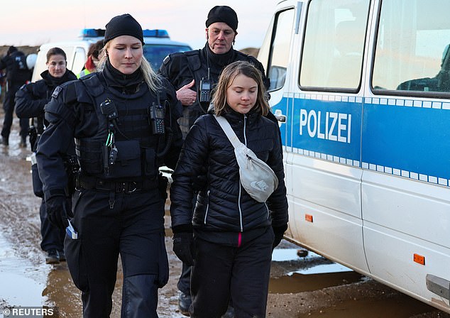 Police detain climate activist Greta Thunberg on Tuesday during protests