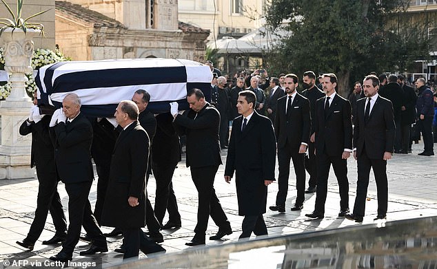 Carriers moved the coffin of the former King of Greece Constantine II while Philippos (3R), Pavlos (2R) and Nikolaos (R) followed their father's coffin during his funeral in Athens.