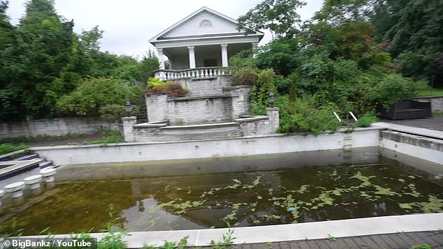 The Long Island mansion looks like it could use some work as seaweed fills the partially empty pool and weeds poke through the cement.  In the photo: the house recently