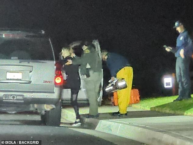 Seen: Gaye's wife, Wendy, was seen being assisted by paramedics and police outside the home after the alleged incident on Thursday.