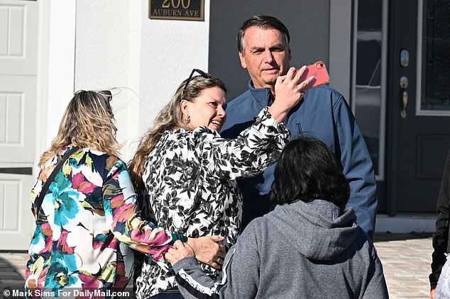 Fans of the president flocked to Bolsonaro with their phones in hand to take selfies with him.