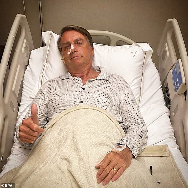 The president is shown here on January 3, 2022, giving a thumbs up from his hospital bed after being admitted for abdominal problems, in Sao Paulo, Brazil.