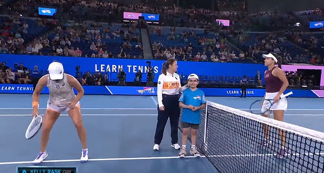 The world number one and top seed (pictured left) frantically squeaked her shoes into the net before the first point on Wednesday during warm-ups.