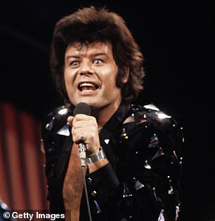 Pictured: Pop pedophile Gary Glitter, real name Paul Gadd, performing in London in 1973