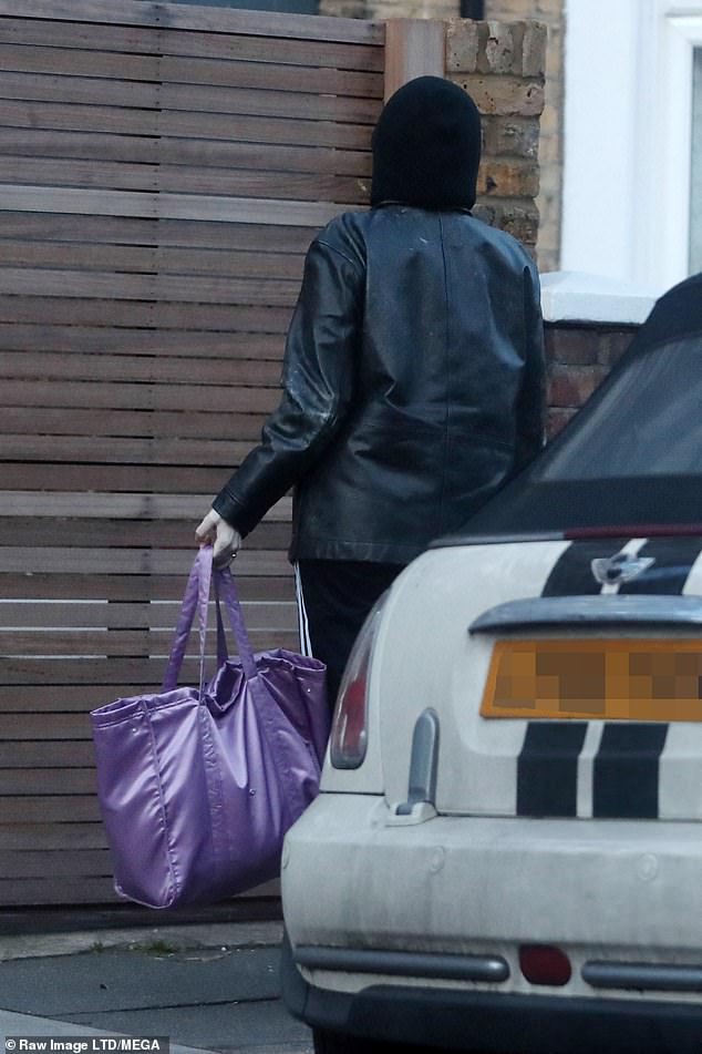 Casual: Stacey kept a low profile on her walk home as she bundled up in a black leather jacket and matching hoodie