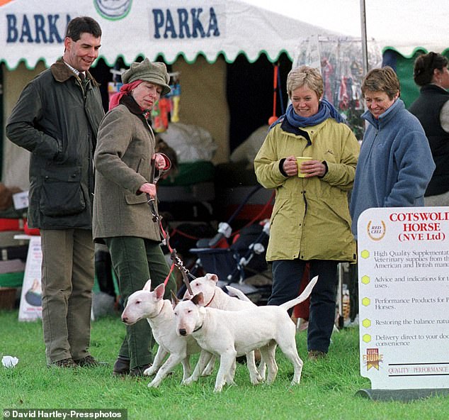 Anne holds tightly her three English bull terriers during the Gatcombe Horse Trials in 2003. Among the dogs pictured are Dotty and Florence, both of whom had attacked people.