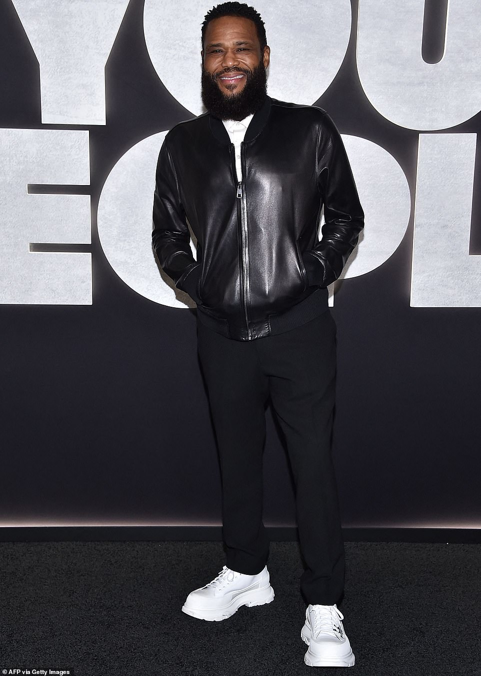 Megawatt charm: Anthony Anderson, who was the male lead of Kenya's show Black-ish for the entirety of his successful eight-year run, made his presence felt in a sleek, gleaming black leather bomber jacket