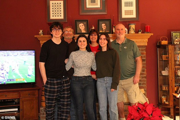 After a full day of traveling 10,000 miles, Natalie (center) finally made it home on Christmas Eve (pictured with her brother Ryan, sister Emily, godfather Michael, mother Donna, and father John)