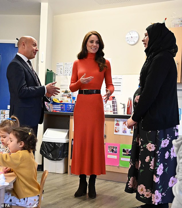 She paired the coat with a £1,600 red sweater and skirt combo by Gabriela Hearst and trendy winter boots for the occasion.