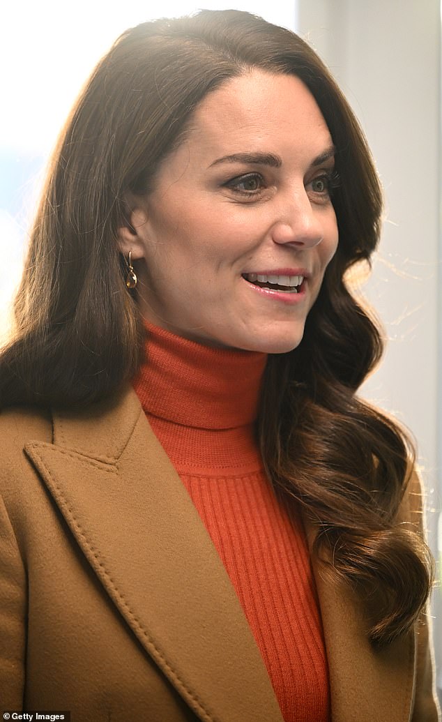 The mother-of-three looked typically poised during the engagement and couldn't resist playing with some of the kids who were left at daycare today.