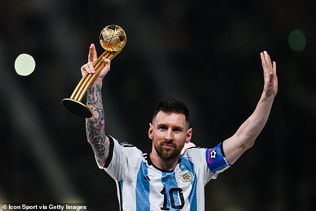 Lionel Messi led Argentina to a famous World Cup victory over France.  He is pictured holding his Ballon d'Or award aloft in Qatar in December.