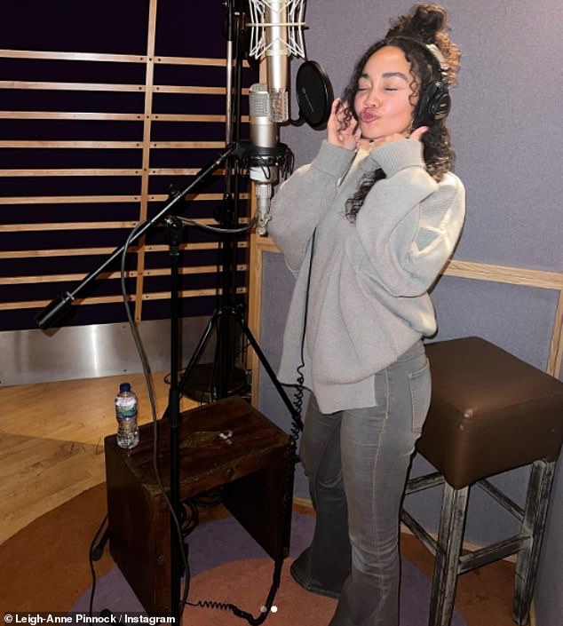 Singing her heart out: Leigh-Anne took to Instagram to share snapshots of her time in the studio and shared a cryptic caption hinting at a 