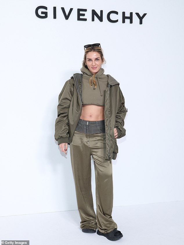 Chiseled: She posed next to Gaia Repossi, who showed off her toned midriff in a green hoodie