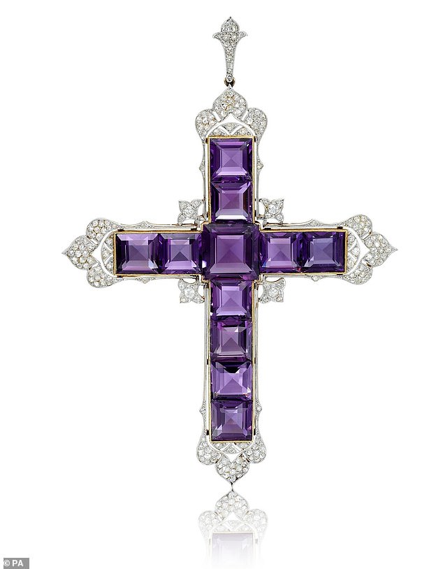 The cross pendant was made in 1920 by the Garrard jewelry company.  According to Vogue, Diana was a friend of the owner, businessman Naim Attallah, who lent it to her.