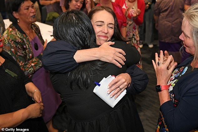 Ms Ardern is seen hugging other MPs after announcing she would step down from the top post.