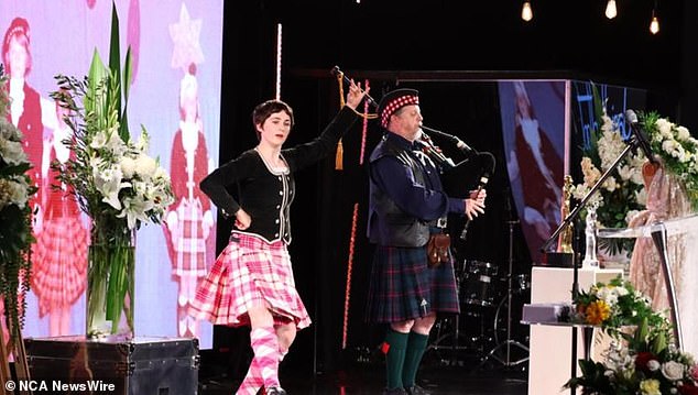 At one point in the service, a woman in a kilt danced while a man played the bagpipes.