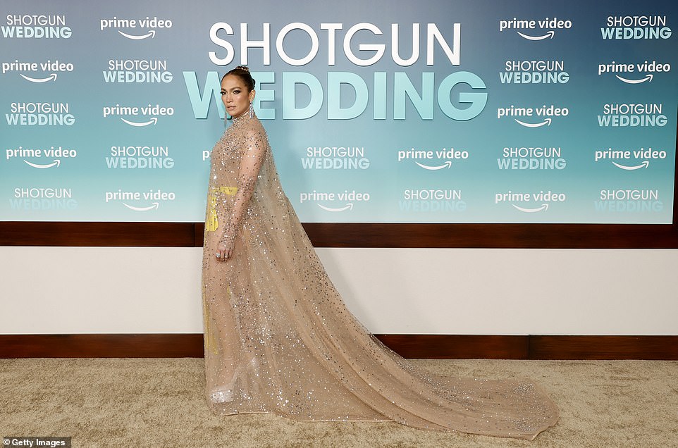 Scene stealer!  Ever the professional, JLo turned heads when he struck a series of glamorous poses alone on the red carpet.