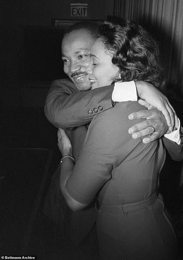 Dr. Martin Luther King Jr. hugs his wife Coretta after learning she received the 1964 Nobel Peace Prize.