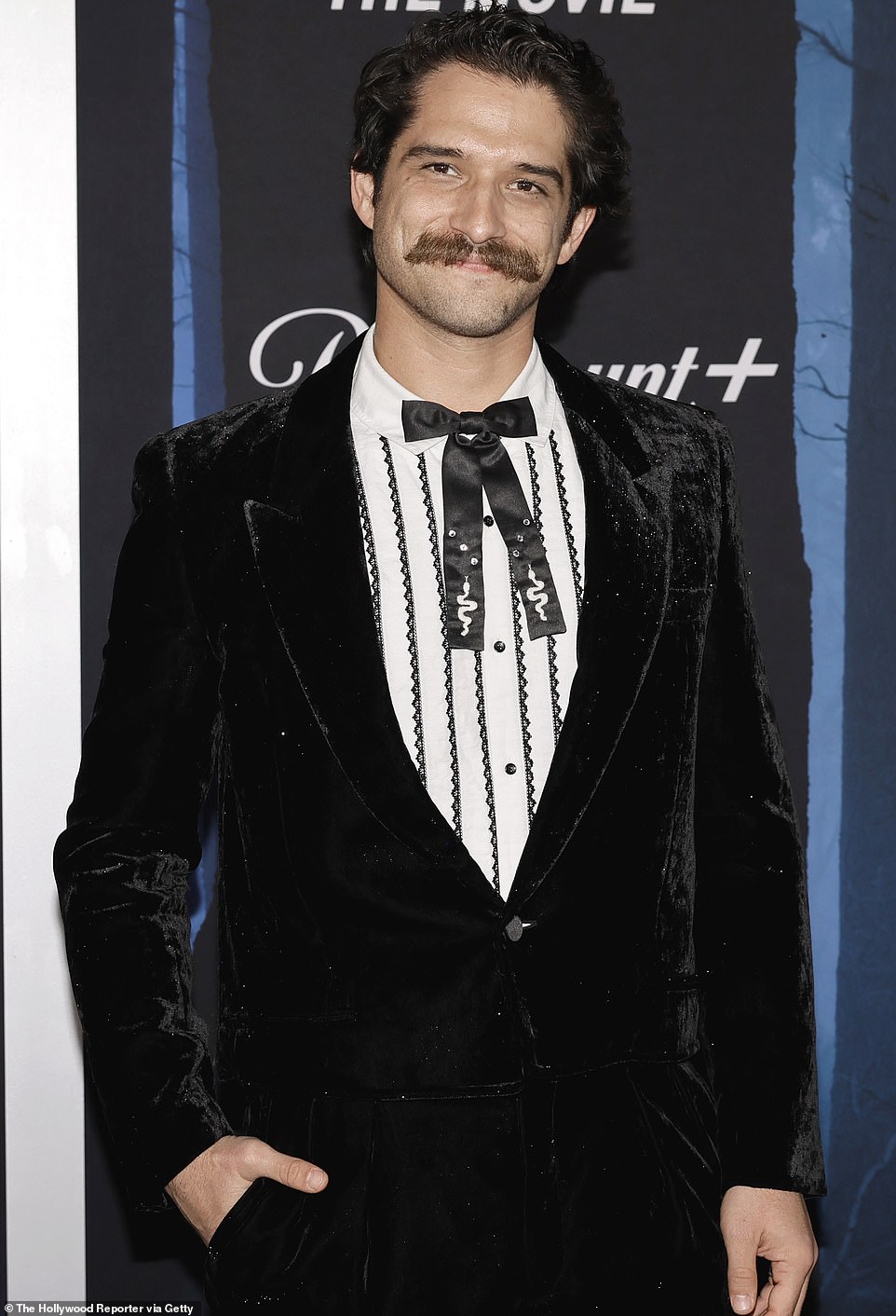 Hunk-tastic: Tyler was almost unrecognizable as he went Wild West chic with a massive handlebar mustache, a monochrome 19th century-style striped shirt and Kentucky bow tie.