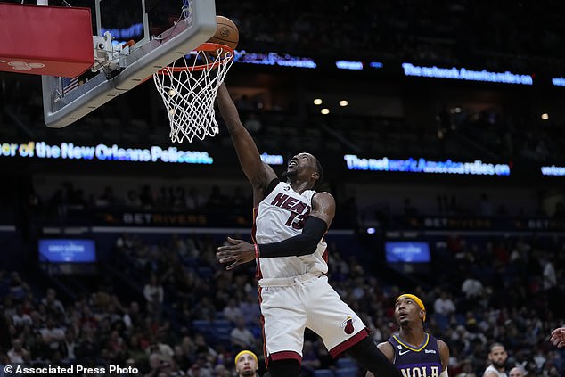 Miami Heat center Bam Adebayo (13) goes for the basket in the second half against the Pelicans