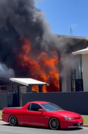 Neighbors saw the black smoke (pictured)