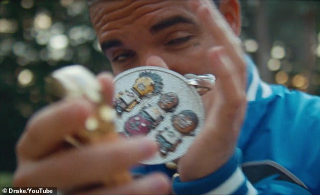 Showing off his shine: Drake shows off the 14-karat, three-tone NERD piece multiple times in the music video.