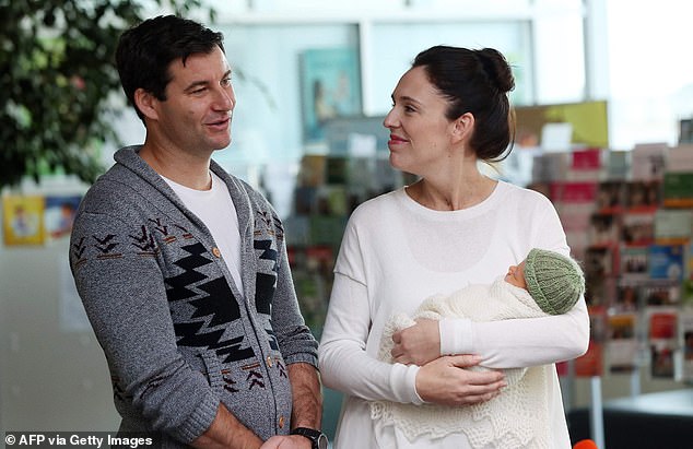 Ms Ardern and her partner Clarke Gayford pose with their young daughter Neve Te Aroha outside the Ardern Gayford hospital in Auckland on June 28, 2018