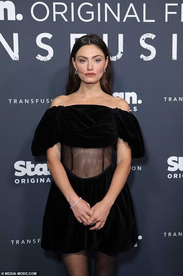 He was joined by his co-star Phoebe Tonkin, who looked elegant in an off-the-shoulder black dress that showed off a see-through midriff.