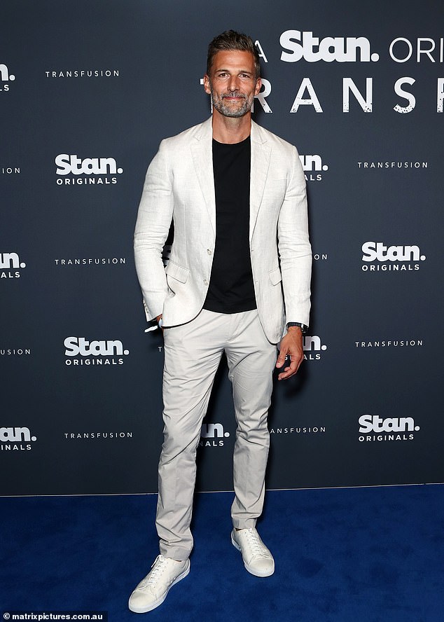 Former Bachelor star Tim Robards looked dapper in a monochrome fit