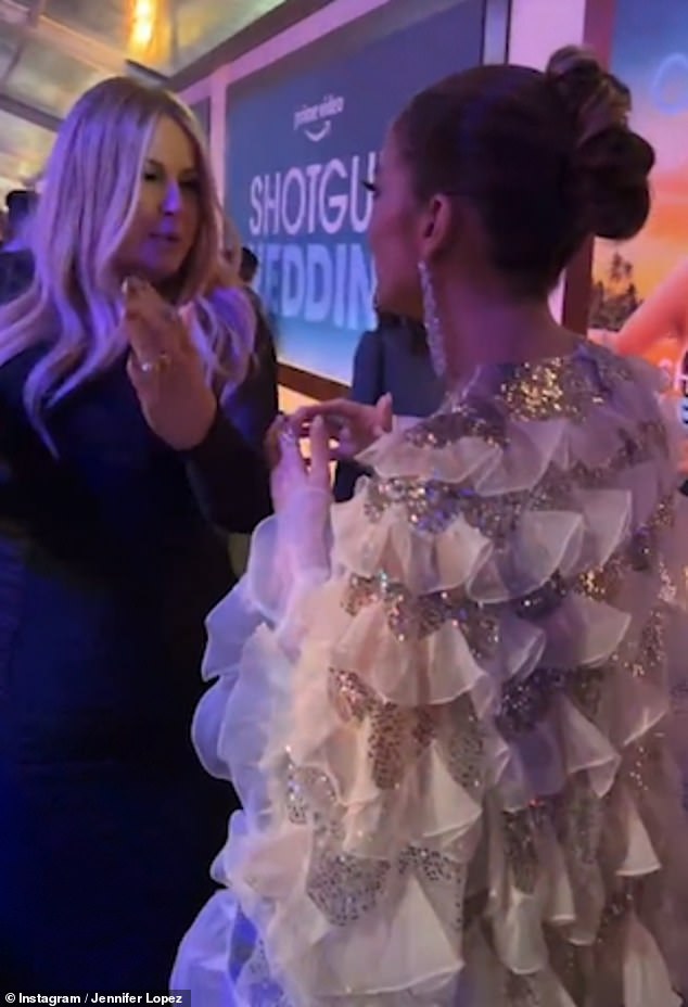 Best Friends!  At the beginning of the video, J-Lo could be seen mingling with her co-star and recent Golden Globe winner Jennifer Coolidge after walking the red carpet at the premiere.