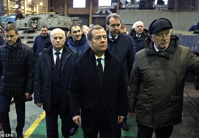 The former Russian president, now vice president of the Russian Security Council (in the center of the photo on January 10 inspecting a military repair plant in St. Petersburg) appeared to be warning NATO leaders to stop the supply of major new weapons. to Kyiv.