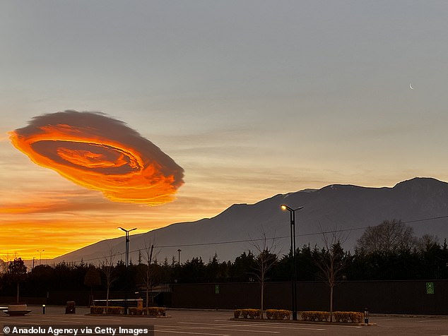 This type of formation is known as a 'lenticular cloud' - a cloud that forms when the air is stable and winds blow across hills and mountains from the same or similar direction at different heights through the troposphere